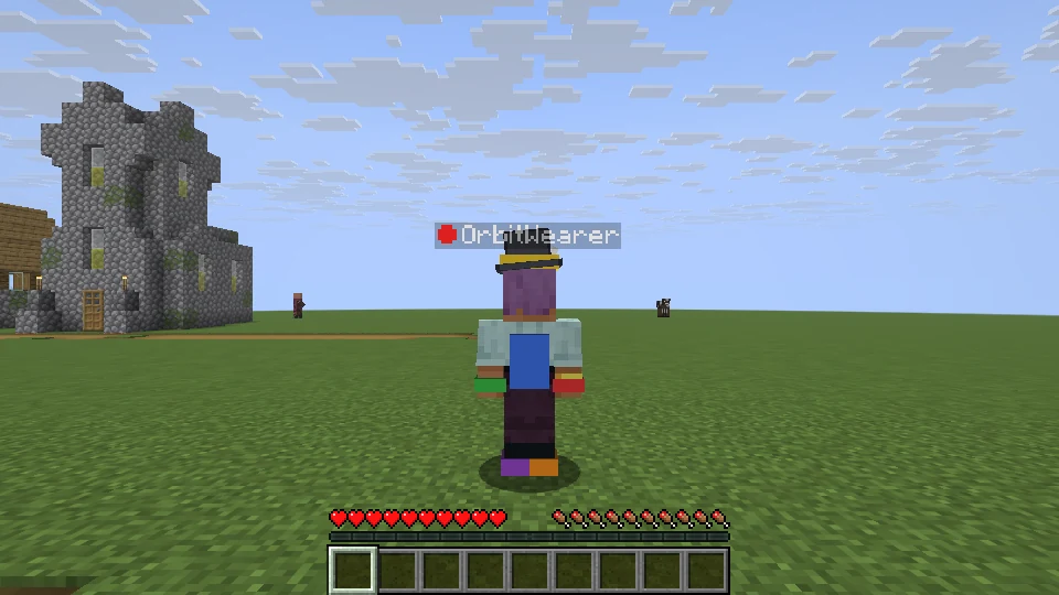 A Minecraft player wearing a top hat, coloured gloves and boots made in Blockbench, with the Orbit dot before their name.